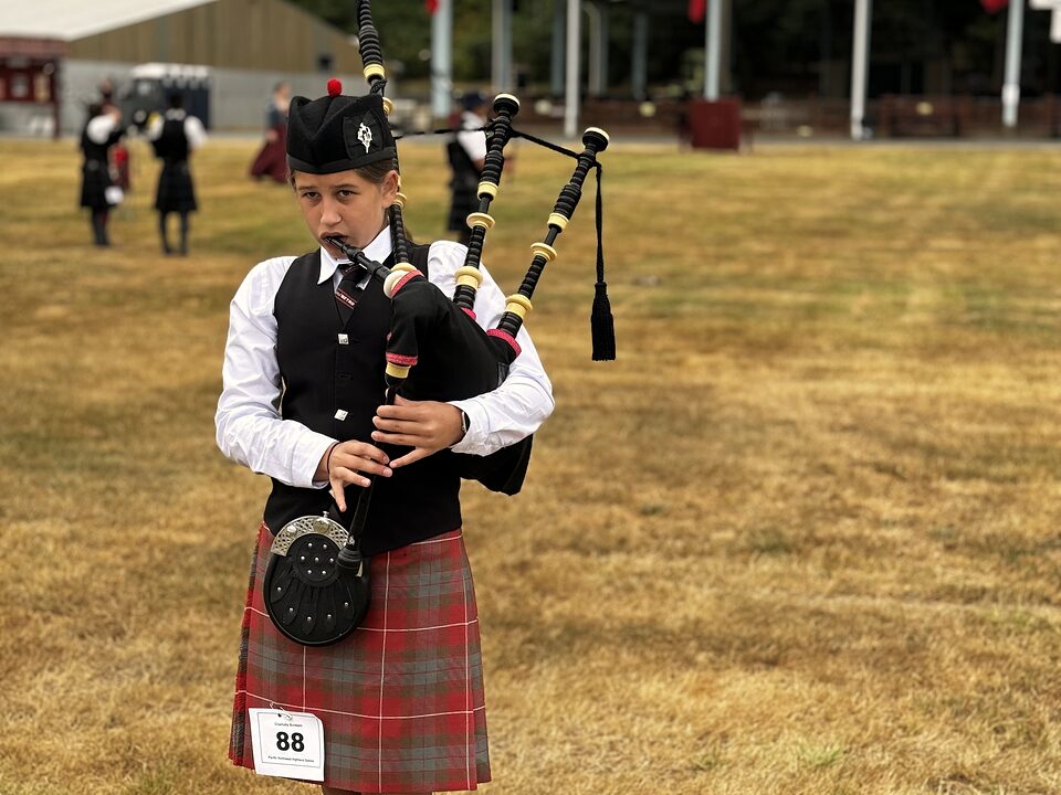 Charlotte Burslem in full Highland dress at a Portland event