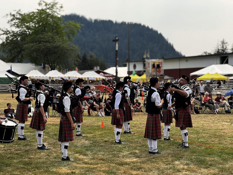 Pipers in formation leading a ceremonial procession