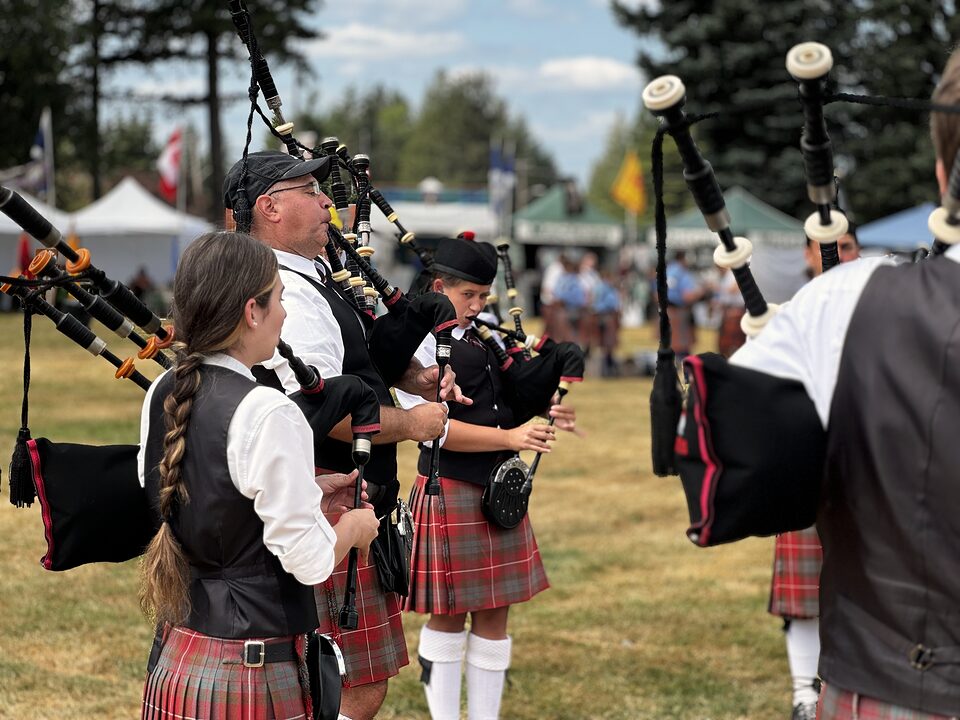 Bagpiper playing at a lively celebration in Portland, Oregon